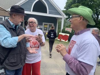 From left, photographer Bob Bond of 40 Federal Studio in Wiscasset, selectman and St. Philip’s member Terry Heller and outgoing St. Philip’s priest in charge Tom Junkert chat at the Strawberry Festival. SUSAN JOHNS/Wiscasset Newspaper