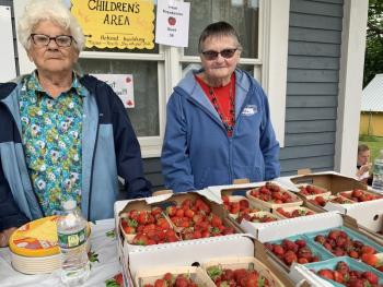 St. Philip’s Episcopal Church lifelong members Delia Dalton, left, and Linda Trowbridge help as usual at the Hodge Street, Wiscasset church’s Strawberry Festival June 29. SUSAN JOHNS/Wiscasset Newspaper