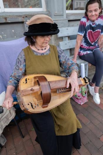 Musician Laurie Rousseau, in costume, plays hurdy-gurdy during the June Wiscasset Art Walk. Bob Bond/40 Federal Studio