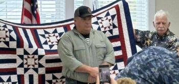 U.S. Marine Corps veteran Michael Bradley received a quilt Sept. 21 in appreciation for his military service. Courtesy photo Michael Bradley