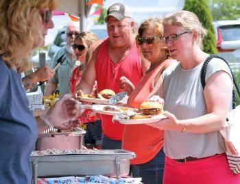 Filling the plates at the Boothbay Harbor First Department barbecue. STEVE EDWARDS/Boothbay Register