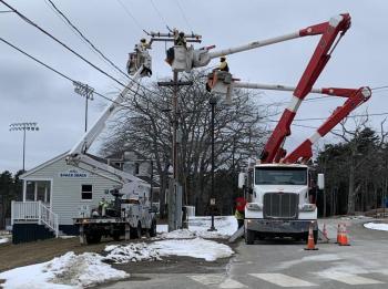 Replacing equipment on a utility pole at Boothbay Region High School. KEVIN BURNHAM/Boothbay Register