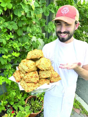 Treats’ Brad McCrary with savory bacon chive biscuits. Courtesy of Stacy Linehan 