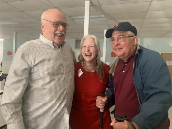 2025 Maine Teacher of the Year Becky Hallowell, who teaches fourth grade at Wiscasset Elementary School, is flanked by her uncles Michael “Jim” Bilinsky, left, and Daniel Fortin Oct. 10 at a reception after Hallowell learned she’d won the statewide honor. SUSAN JOHNS/Wiscasset Newspaper 