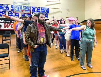 In Stover Auditorium May 31, Wiscasset Middle High School seniors see how far apart they should be from the classmate beside them when they march into graduation June 6. SUSAN JOHNS/Wiscasset Newspaper 