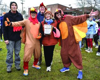 Volunteers and runners spread Thanksgiving cheer before the start of the 2024 Boothbay Region Turkey Trot. FRITZ FREUDENBERGER/Boothbay Register