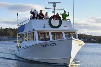 Santa and his entourage arriving by boat to Whale Park Dec. 7. FRITZ FREUDENBERGER/Boothbay Register