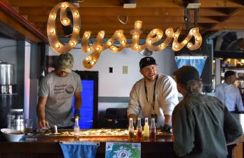 Serving up oysters at the 2024 Pemaquid Oyster Festival. FRITZ FREUDENBERGER/Boothbay Register