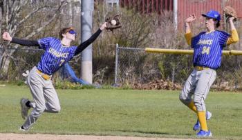 Seahawk Sam Markowitz reaches for a catch as teammate Casey Phelps moves out of the way at a game against Mt. View May 10. FRITZ FREUDENBERGER/Boothbay Register