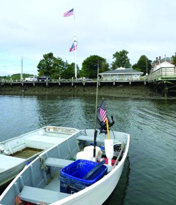 The wind keeps a small American flag and a big one moving Sept. 7 on the Wiscasset waterfront. SUSAN JOHNS/Wiscasset Newspaper 