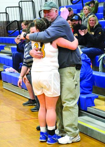 Seahawks senior Margret "Meg" Sledge gets a hug from her father, Matt Sledge, during Senior Night. KEVIN BURNHAM/Boothbay Register