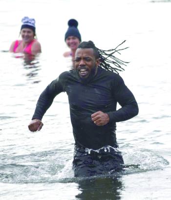 One of the participants in the Penguin Plunge can't leave the water fast enough. KEVIN BURNHAM/Boothbay Register