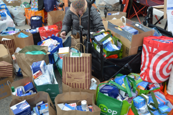 First aid kits collected to be sent Down East, where immigrants are in need of supplies because they are afraid to leave their houses to go to the emergency departments at hospitals or to urgent care, or to go to the store to buy bandaids and Tylenol. (Photo by Lynda Clancy) c