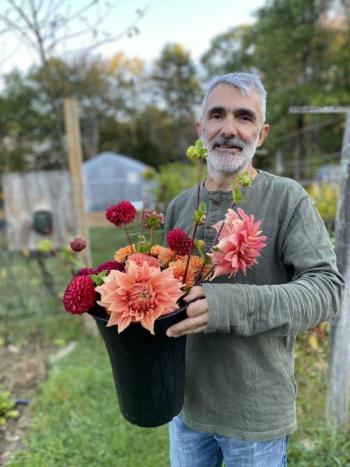Alain Ollier with dahlias. Courtesy of Veggies to Table