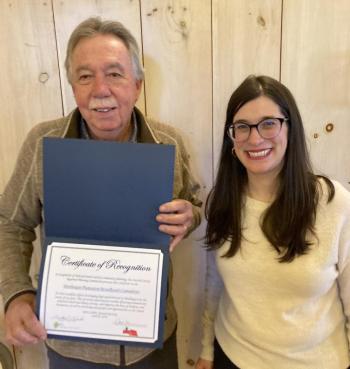 Bill Boynton, member of the Monhegan Broadband Committee and Emily Rabbe, Executive Director of LCRPC, displaying the award Monhegan's Broadband Committee received for their community planning efforts. Courtesy of LCRPC