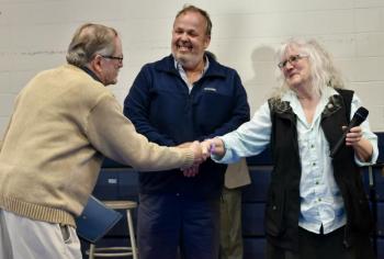 Selectmen Allison Hepler and Jason Shaw present the “Spirit of America Award” to Allen Greene, a former planning board member and selectman. PHIL DI VECE/Wiscasset Newspaper 