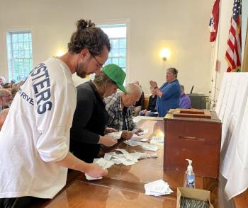 Counting written ballots for warrant Article 15. FRITZ FREUDENBERGER/Boothbay Register