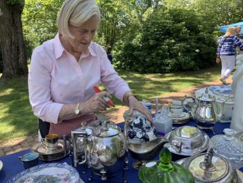 First Congregational member Linda Winterberg works in the treasures section at a Summerfest past. File photo 