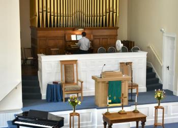 Joel Pierce, the church’s music director, organist and choir director plays the church's current organ manufactured by the Estey Organ Company in 1909. PHIL DI VECE/Wiscasset Newspaper