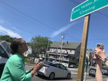 State Sen. Rachel Talbot Ross makes a praying motion and later motioned kisses and applause toward the sign on the southbound side of Route One. SUSAN JOHNS/Wiscasset Newspaper Ceremony