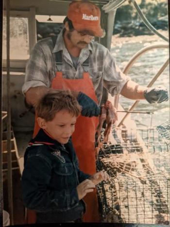 Jerry out with his dad on the family's lobster boat. Courtesy of Jerry Farnham