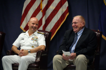 Capt. (ret) Floyston "Bud" Weeks, sits next to Adm. Jim Kilby, Acting Chief of Naval Operations, during his retirement ceremony at SWSC Newport, Naval Station Newport, R.I., July 18, 2025. John Goulette photo Capt. (ret) Floyston "Bud" Weeks, sits next to Adm. Jim Kilby, Acting Chief of Naval Operations, during his retirement ceremony at SWSC Newport, Naval Station Newport, R.I., July 18, 2025. John Goulette photo