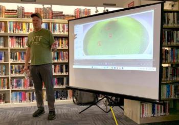 Bill Gerencer shows attendees a stream of an AI-powered ground fish identifier that can classify fish type, age, size, and location. ISABELLE CURTIS/Boothbay Register