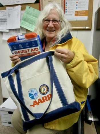Woolwich select board member and State Rep Allison Hepler shows one of the "Care Bags" provided by Age-Friendly Communities of the Lower Kennebec. PHIL DI VECE/Wiscasset Newspaper