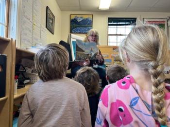 Deb Johnson of the Maine Mineral and Gem Museum in Bethel speaks to CTL students about fossils as part of all-school geology and paleontology study. Courtesy of CTL
