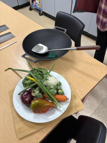 Wok & Cleaver Boot Camp comes with an iron wok, long-handled wok spatula, carbon steel cleaver, honing steel sustainable wooden cutting board and one of Chris Toy's six cookbooks, a $230 value. Courtesy photo