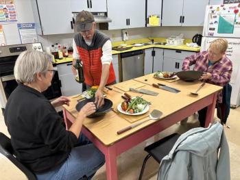  Chris Toy demonstrates how to season a new wok in the fall session of Wok & Cleaver Boot Camp. Courtesy photo 