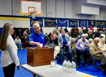EMS Director Danny Evarts places his ballot in the ballot box. PHIL DI VECE/Wiscasset Newspaper 