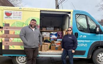 HLC’s Will Matteson and Samantha Mehlhorn stand with LuLu packed and ready to go out on a day of deliveries. Courtesy photo  