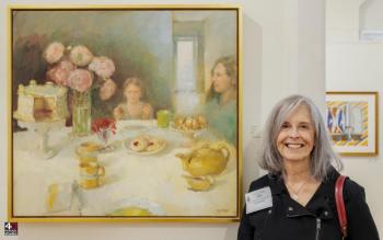Tina Ingraham with her painting “High Tea” at Maine Art Gallery, Wiscasset, ME. Bob Bond photo