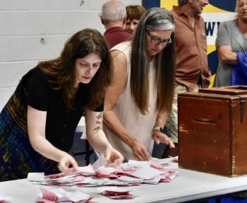 Ballot Clerk Tegan Rand (l) and Kim Dalton town administrator/town clerk sort the ballots. PHIL DI VECE/Wiscasset Newspaper