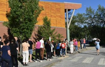 At one point the line of voters waiting to get into the town meeting at the Woolwich Central School stretched outside the building. PHIL DI VECE/Wiscasset Newspaper