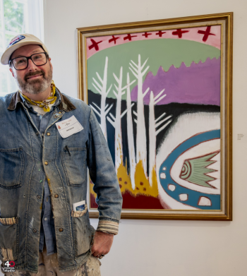 Matt Barter with his painting "March Bog #3" at the current Maine Art Gallery show. Photo by Bob Bond