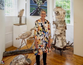 Sculptor Lesia Sochor with her 3D animals made of birch bark at the opening of "Song of the Wild" at the Maine Art Gallery. Photo by Bob Bond