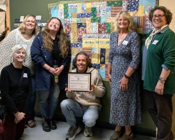 Andrew Slater, MMCA Child and Family Services Director, with MMCA staff and board members. Courtesy photo