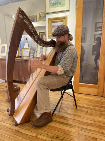 Alex Bigney plays Celtic harp at the Wiscasset Bay Gallery during Wiscasset Art Walk. Lucia Droby photo