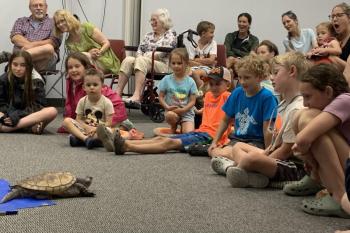 Don't worry, he doesn't bite! The excitement was palpable Aug. 7 as attendees got a tour of Mr. Drew's exotic animals from his organization in Poland, Maine. ISABELLE CURTIS/Boothbay Register