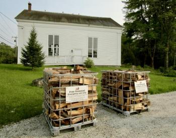 Last year cages containing free firewood meant for those in need were placed across from the town office. (file photo)