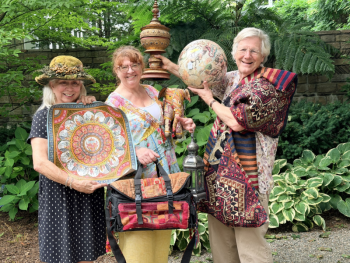 From left to right Linda Marshall, Christine Buckley of Camden Curated and Christine's Framing Gallery, and Dr. Stephen Huyler, with some of the exotic treasures being readied for the epic estate sale hosted by Stephen and Helene on their property, Sept. 19 to benefit Finding Our Voices. Patrisha McLean photo
