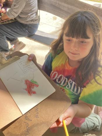 Olivia Westerlund shows off her nature journal. Becky Hallowell photo 