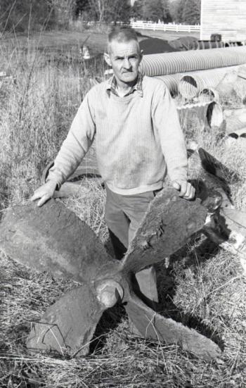 The late Maurice Caton of Wiscasset posed for a picture with the propeller taken by the author in the early 1980s. Cast iron propellers were often used rather than brass ones because they were often broken and cheaper to replace.