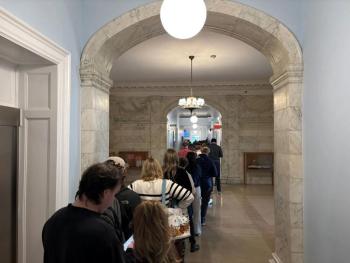 Voters lined up at Portland City Hall for in-person early absentee voting midday on Oct. 28, 2026, waiting more than an hour to cast their ballots. Photo by Emily Bader