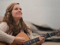 Alice Limoges with guitar