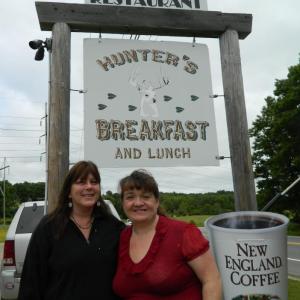 New Owners of Hunter's Breakfast Debbie Churchill, left, and Laurie Leavitt stand ready to welcome their customers. Below, Hunter's breakfast cook Cindy Allen stands at the grill preparing food for the breakfast customers Monday morning.