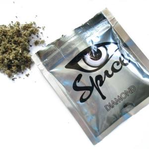 Spice is legally sold in bright packages marked “not for human consumption.” Herbal mixtures laced with chemical additives are smoked for a marijuana-like high with some unintended consequences. Below, Amy and Mike Preston, pictured here at the Alna General Store, are waging a private campaign to raise awareness about the legal high that claimed the life of their 18-year-old nephew in May.