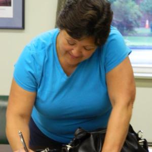 Wiscasset Selectman Pam Dunning Pam Dunning, signs the warrant for the special town meeting Sept. 11, following an early morning meeting July 27. CHARLOTTE BOYNTON/Wiscasset Newspaper